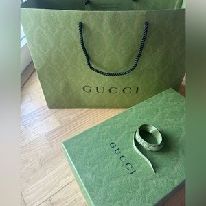 Authentic Gucci shoe box and shopping bag.